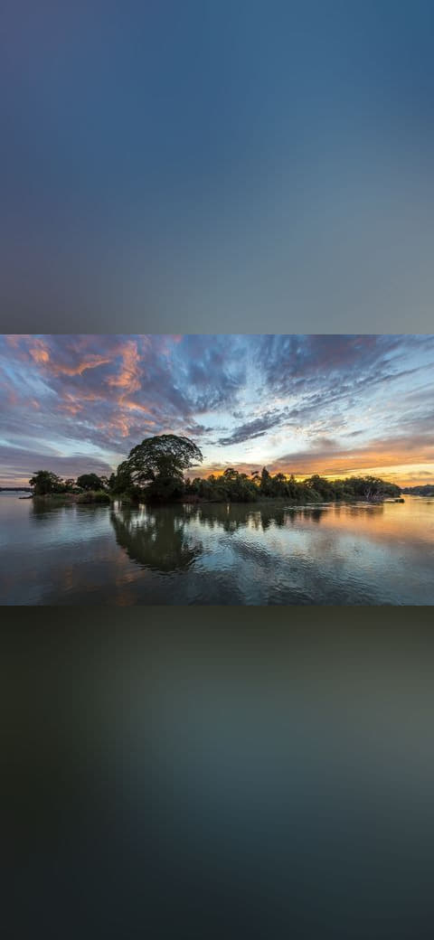 Colorful clouds and blue sky with water reflection… wallpaper in charcoal and charcoal tones, Full HD, 16:9 format for phone