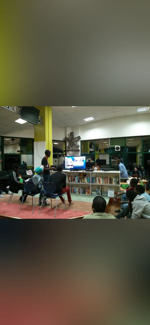 Console setup at a gaming event in Nairobi wallpaper in near-black and olive tones, Full HD, 4:3 format for phone