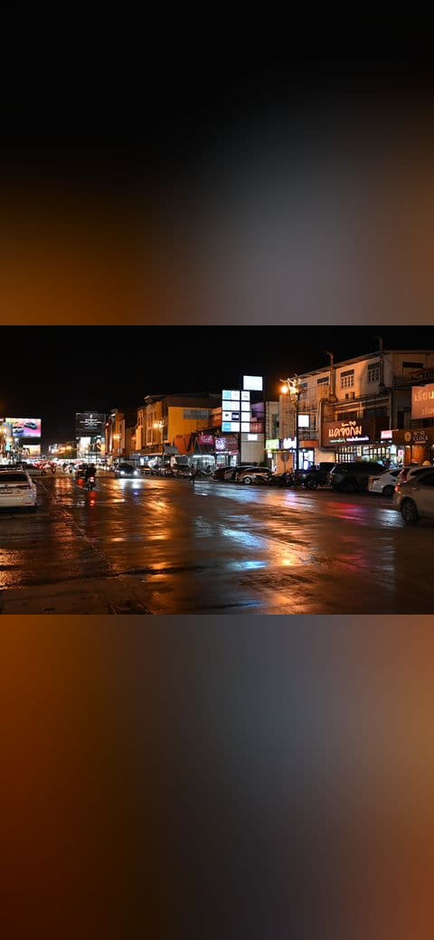 DFC 3503 A wet city street at night shopfronts and… wallpaper in near-black and charcoal tones, Full HD, 4:3 format for phone