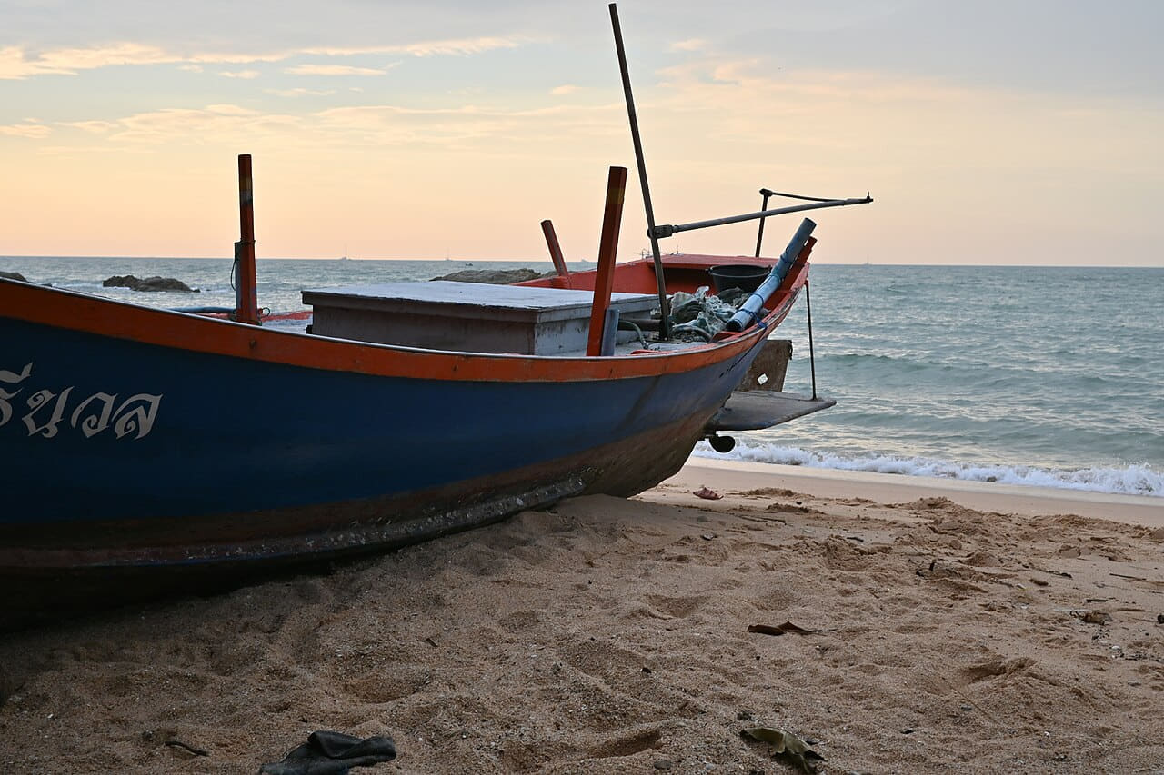 A weathered fishing boat rests on the sandy shore… wallpaper in cream and olive tones, Full HD, 4:3 format for phone