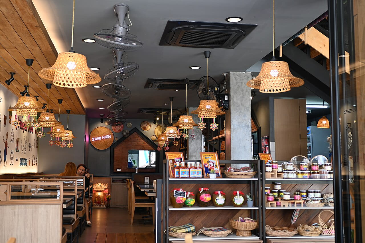 Cozy cafe interior with warm hanging wicker lamps… wallpaper in near-black and olive tones, Full HD, 4:3 format for phone