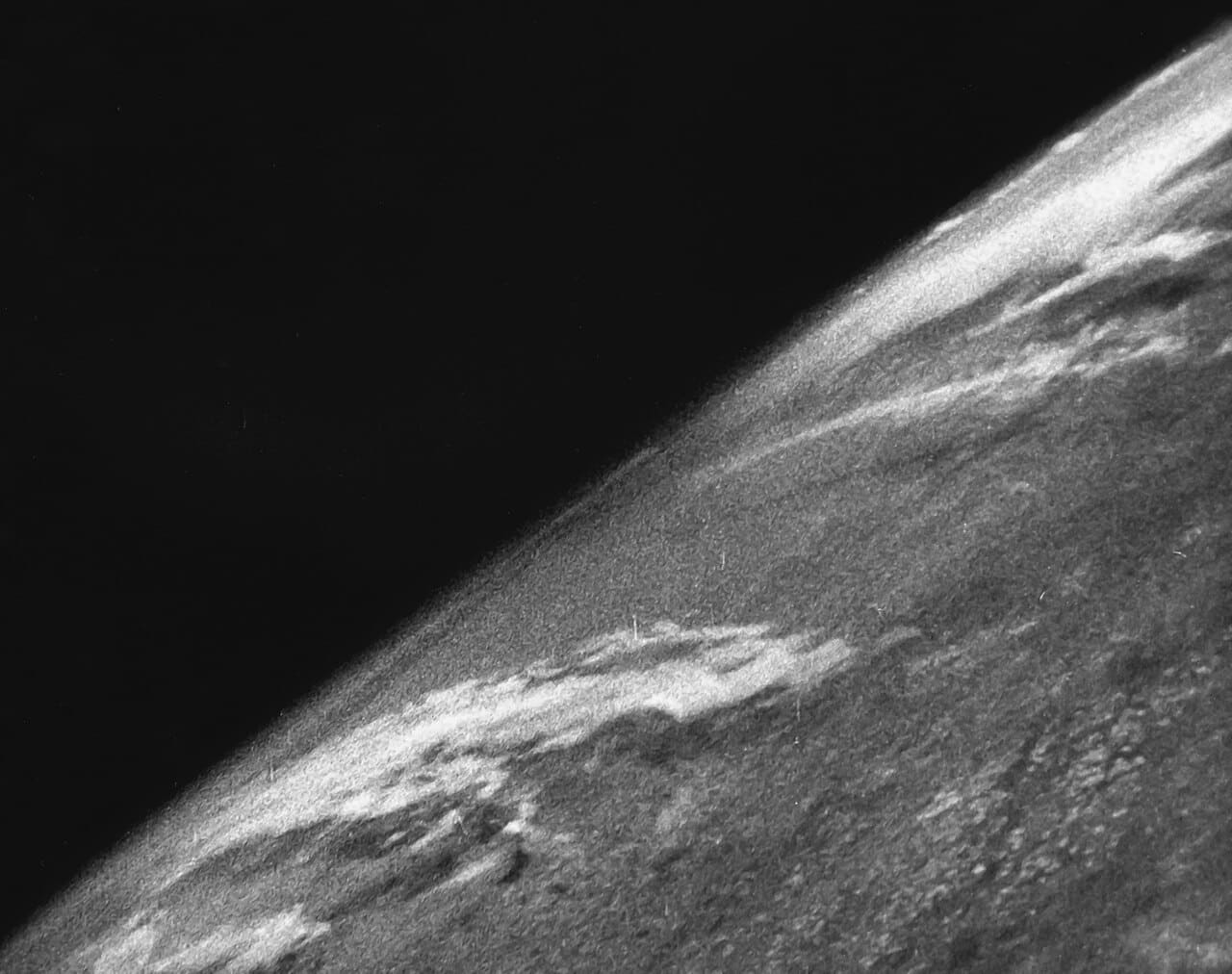 First photo from space wallpaper in near-black and olive tones, Full HD, 4:3 format for phone
