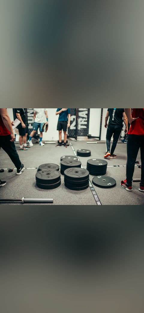 Several athletes and coaches gather in a gym for a… wallpaper in sage green and slate tones, Full HD, 4:3 format for phone