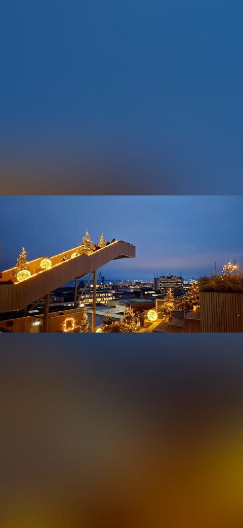 View with Christmas lights 2025 Salling Rooftop 02 wallpaper in steel blue and slate tones, Full HD, 16:9 format for phone
